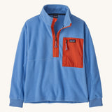 Patagonia kids half zip fleece in light blue colour on a cream background.
