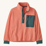 Patagonia kids half zip fleece in light pink colour on a cream background.