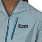 Patagonia women's houdini jacket in light blue front pocket and zip detail