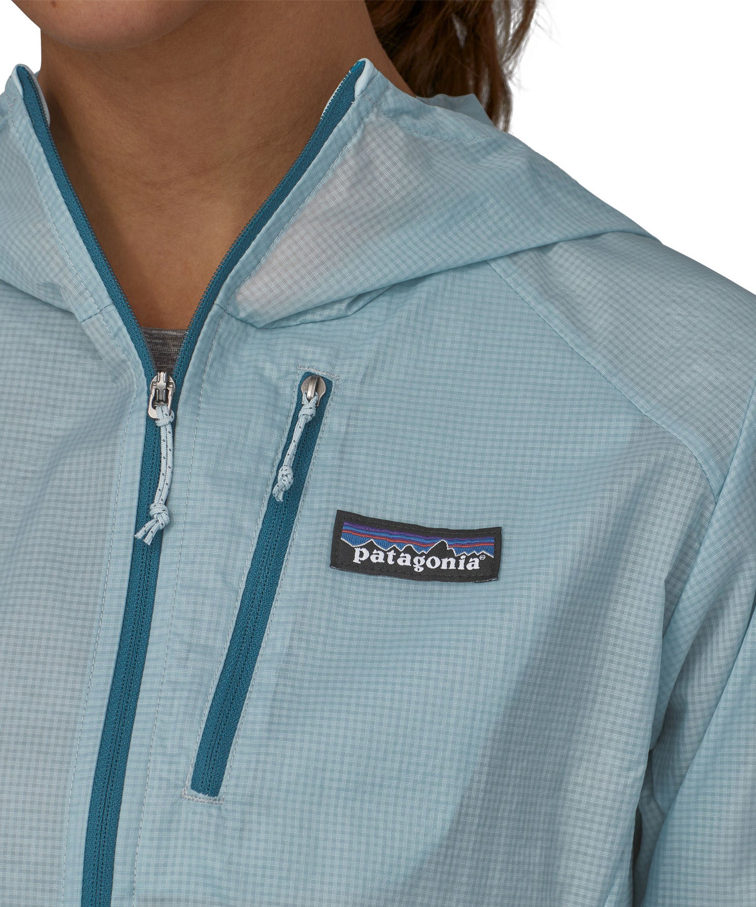 Patagonia women's houdini jacket in light blue front pocket and zip detail