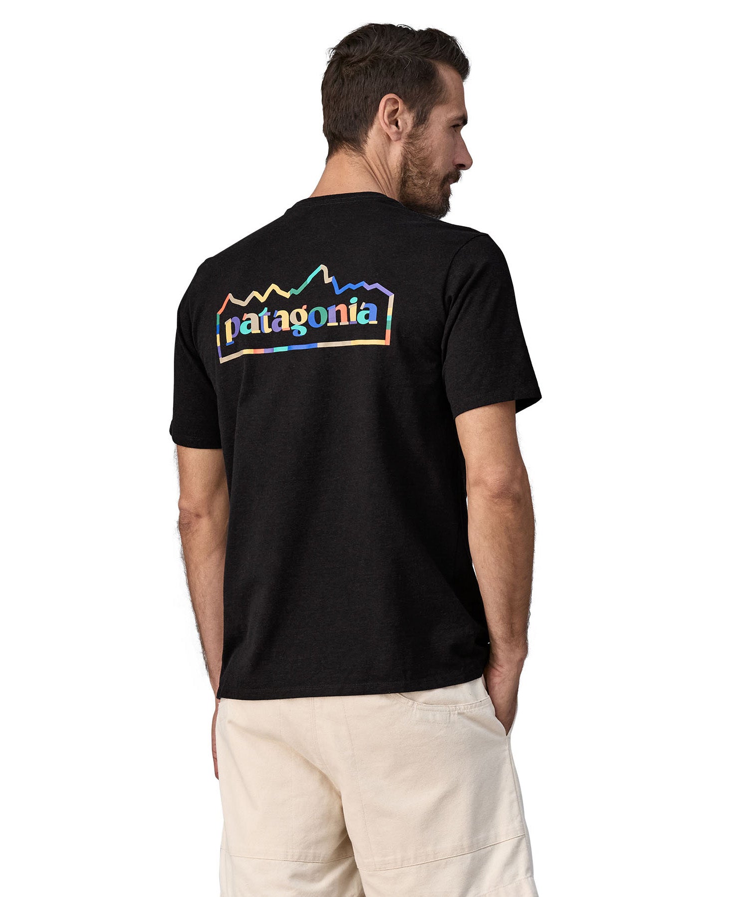 Rear view of the Patagonia Fitz roy unity responsibili top. Showing the large brand print on the top coloured in with block colours
