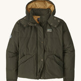 Patagonia downdrift jacket in pine green colour on a cream background.
