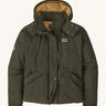 Patagonia downdrift jacket in pine green colour on a cream background.