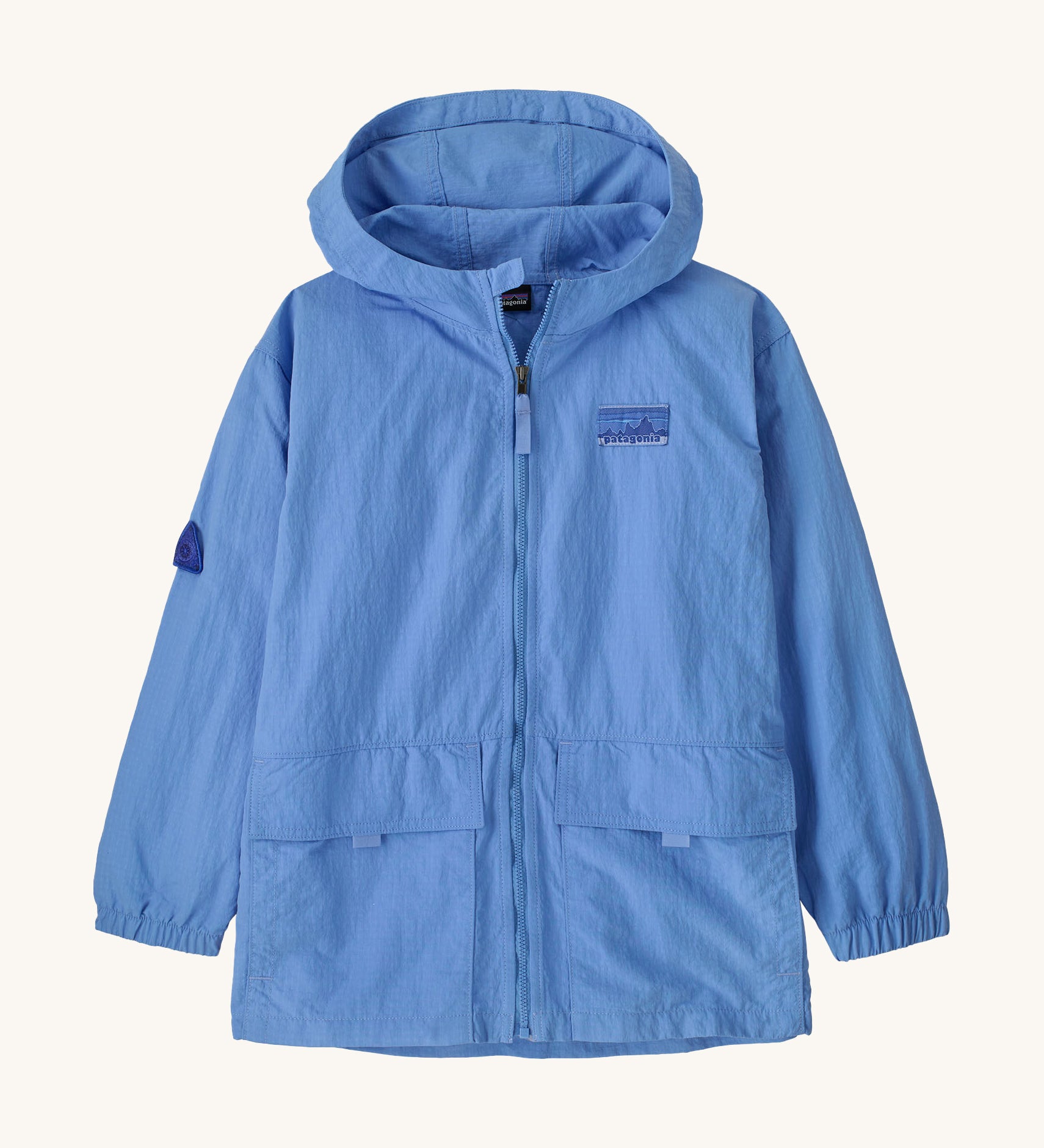 Patagonia kids outdoor everyday jacket in a light blue colour on a cream background.