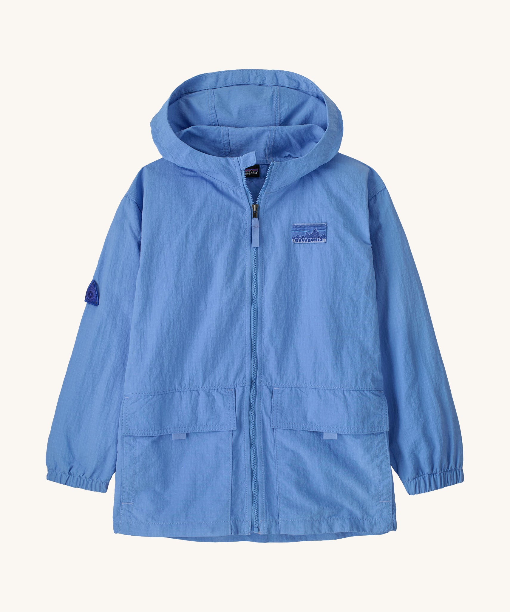 Patagonia kids outdoor everyday jacket in a light blue colour on a cream background.