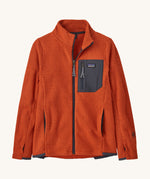 Patagonia air full zip jacket in a dark orange colour on a cream background.