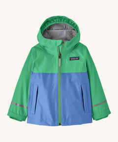 Patagonia kids torrentshell jacket in blue and green colour on a cream background.