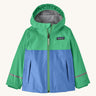 Patagonia kids torrentshell jacket in blue and green colour on a cream background.
