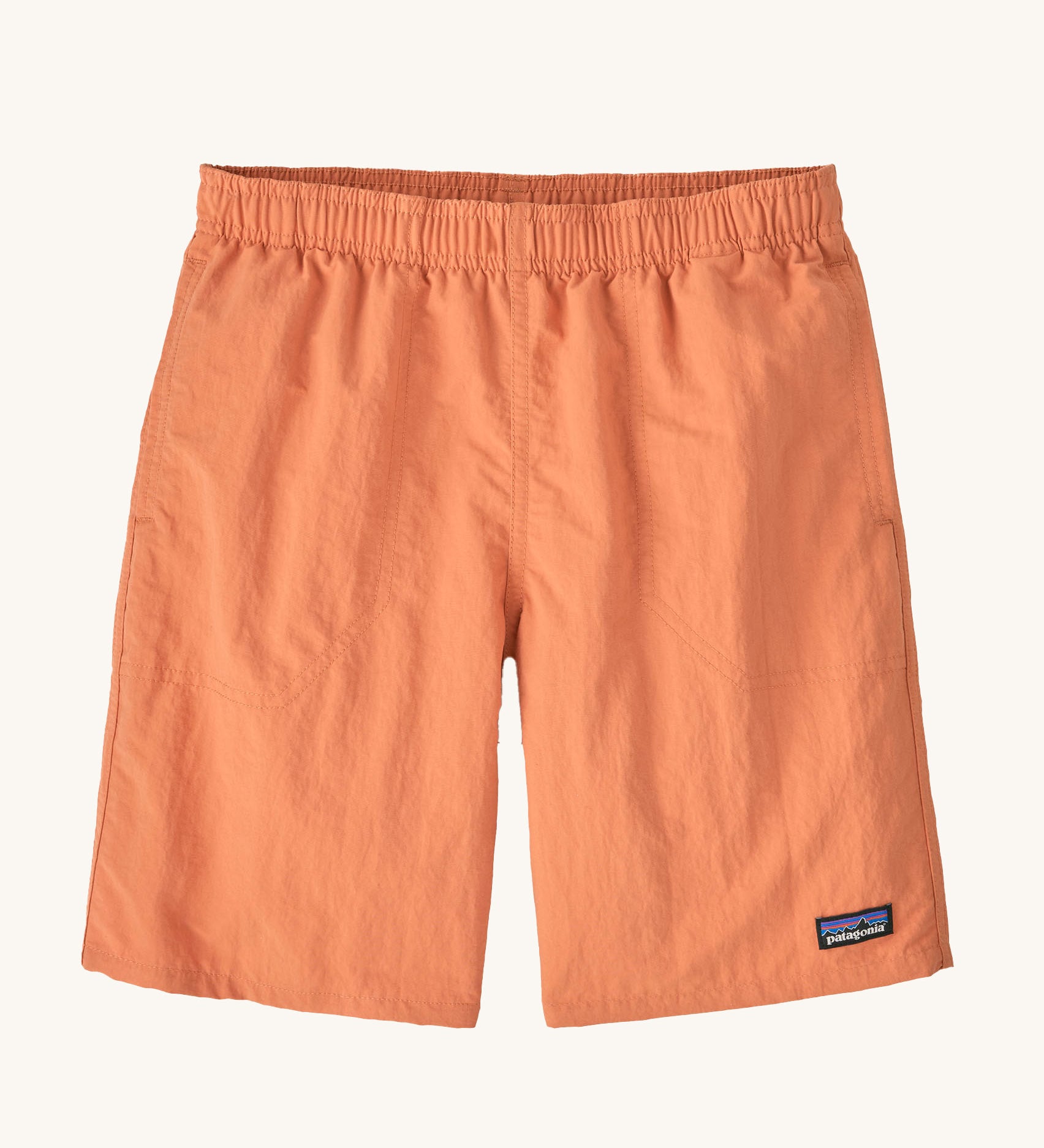 The Patagonia Kids Baggies Lined Shorts 7 Inch in a Rock Melon colour way. 