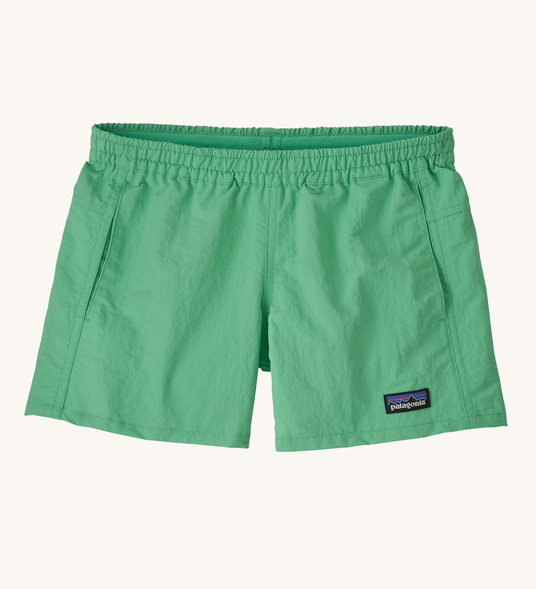 Patagonia Kids Quickdry 4" Unlined Baggies Shorts in an aloe green colour on a plain background. 