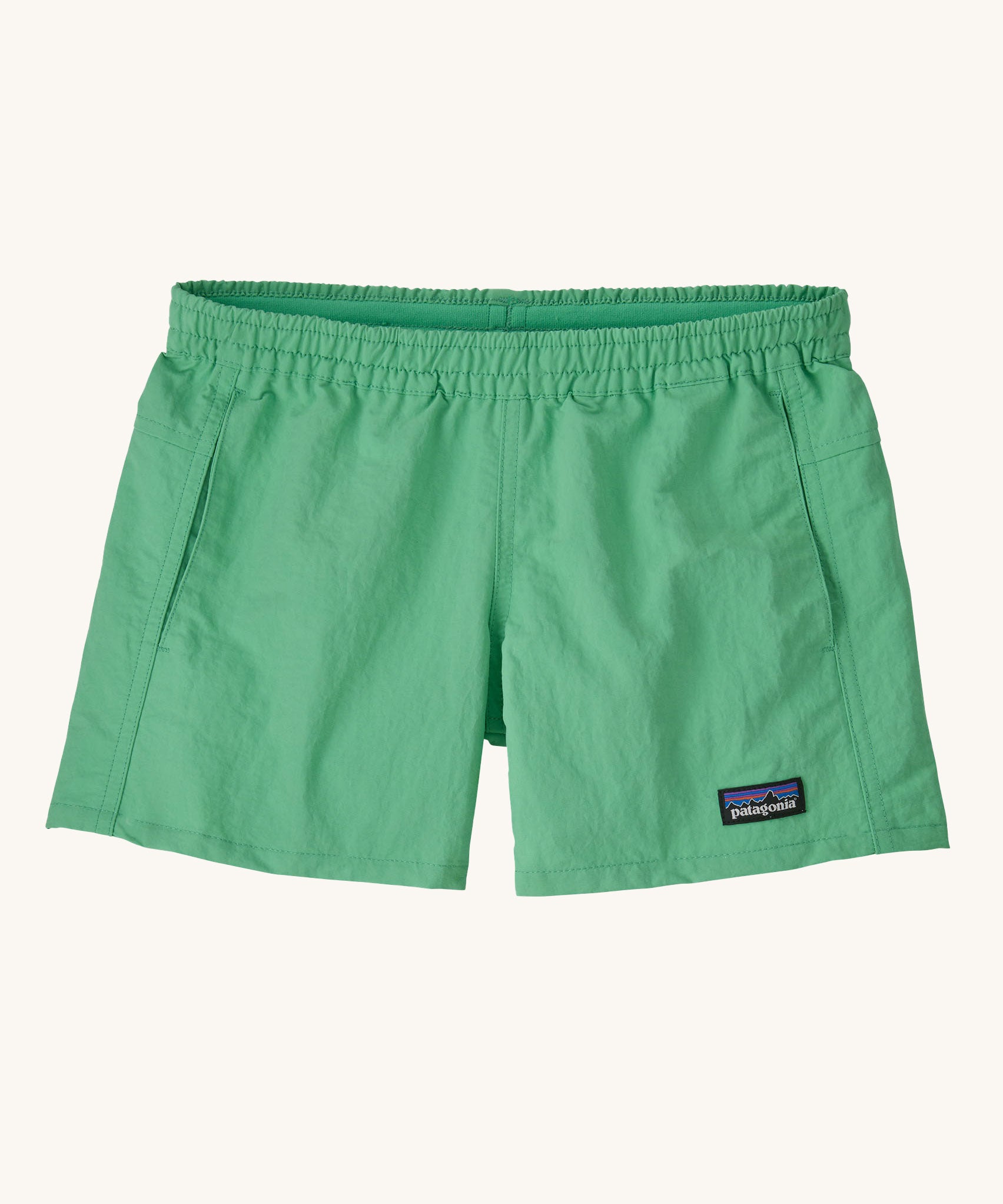 Patagonia Kids Quickdry 4" Unlined Baggies Shorts in an aloe green colour on a plain background. 