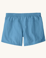 Back of the Patagonia kid's unlined baggies shorts in shore blue with elasticated waistband. 