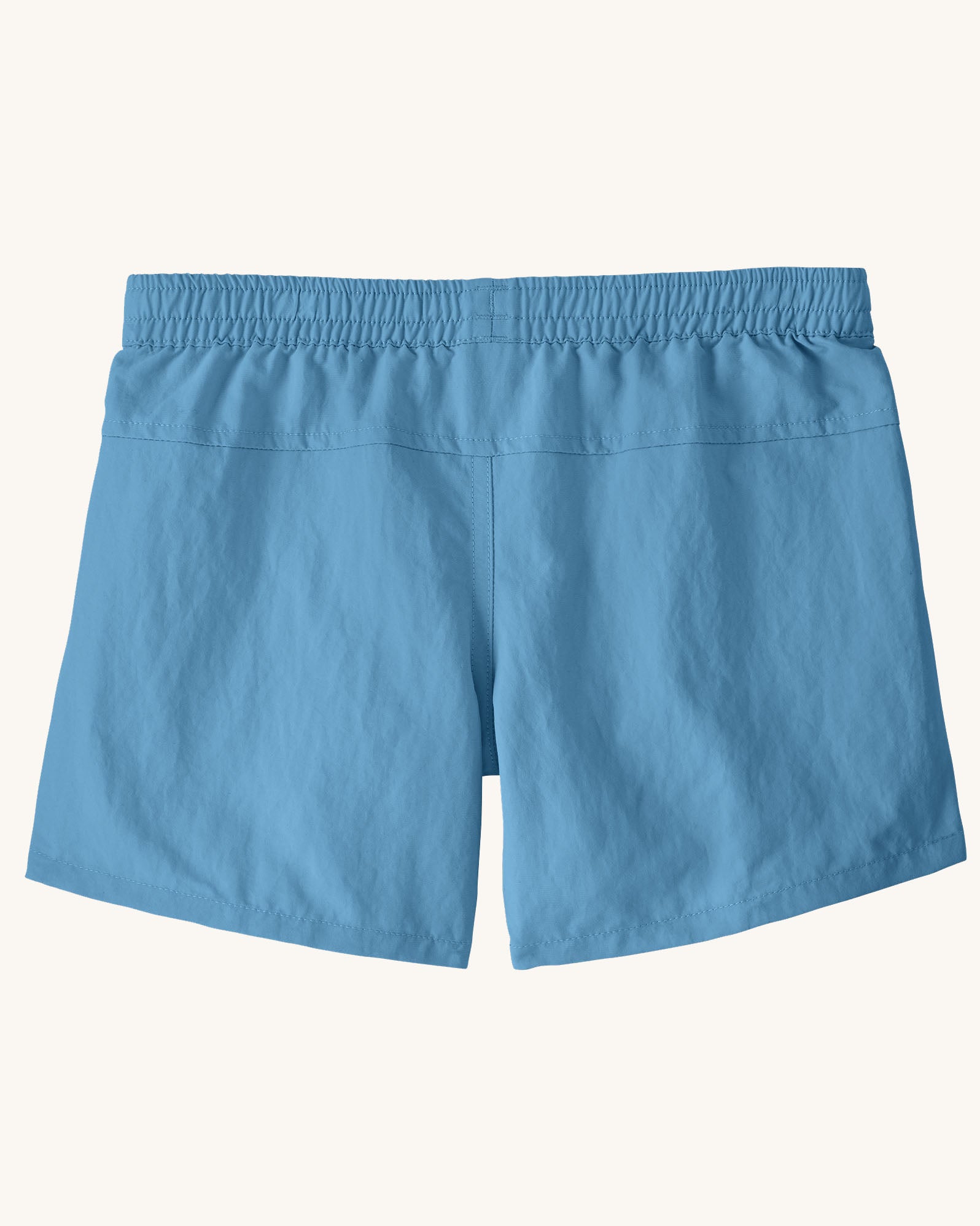 Back of the Patagonia kid's unlined baggies shorts in shore blue with elasticated waistband. 