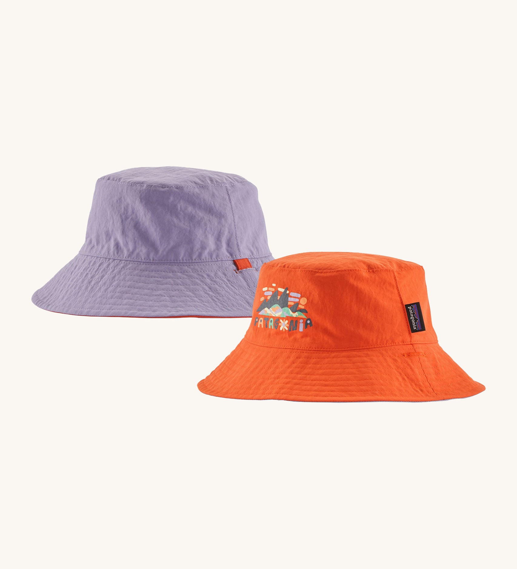 Patagonia kids bucket hat in a pastel purple and orange colour on a cream background.