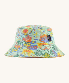 Patagonia kids bucket hat in a pastel green colour and multicoloured pattern design on a cream background.