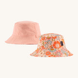 Patagonia kids bucket hat in multicoloured pink flower pattern design  and pink colour on a cream background.