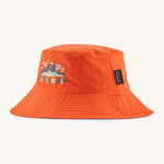 Patagonia kids bucket hat in a orange colour on a cream background.