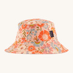 Patagonia kids bucket hat in multicoloured pink flower pattern design on a cream background.