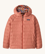 Patagonia Kids Reversible Down Hoody in river river and potters red design. A long sleeve jacket in pale pink featuring a full length zip and a colourful paisley design on the inside