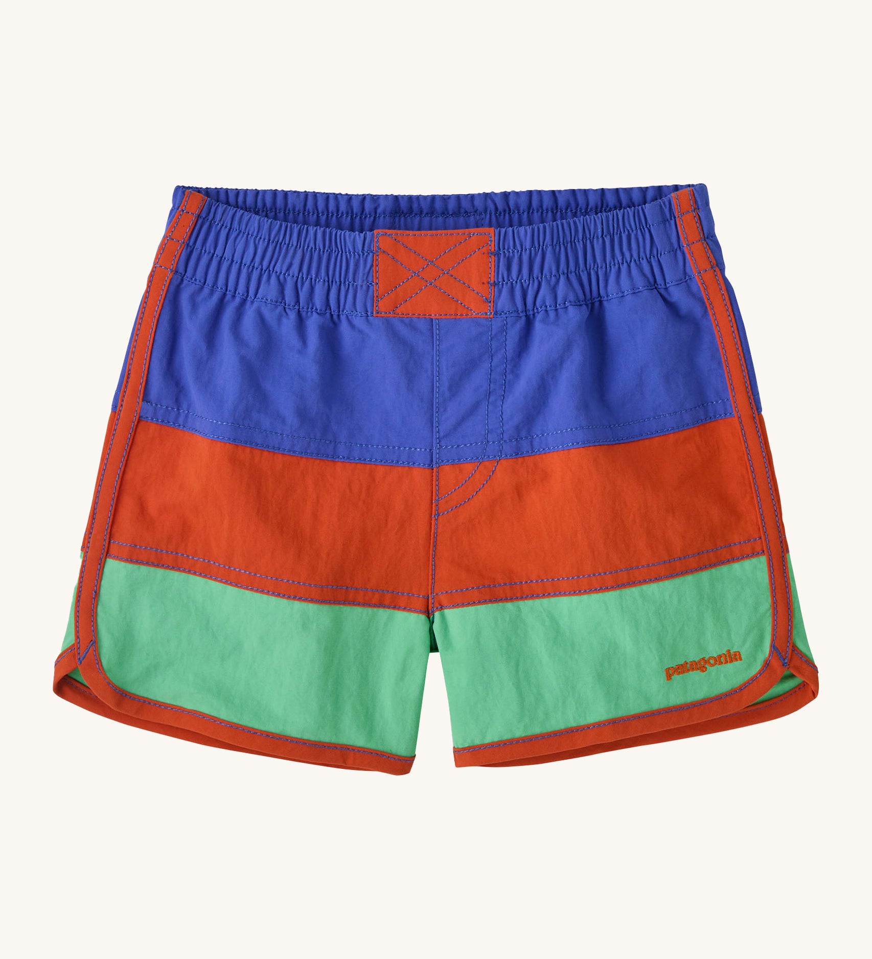 Patagonia kids swim shorts in 3 colour-block panel stripes - blue, red and light green - with binding down the seams and leg openings in red and scalloped detail at the side. Made with quick-drying NetPlus® 100% post-consumer recycled nylon.