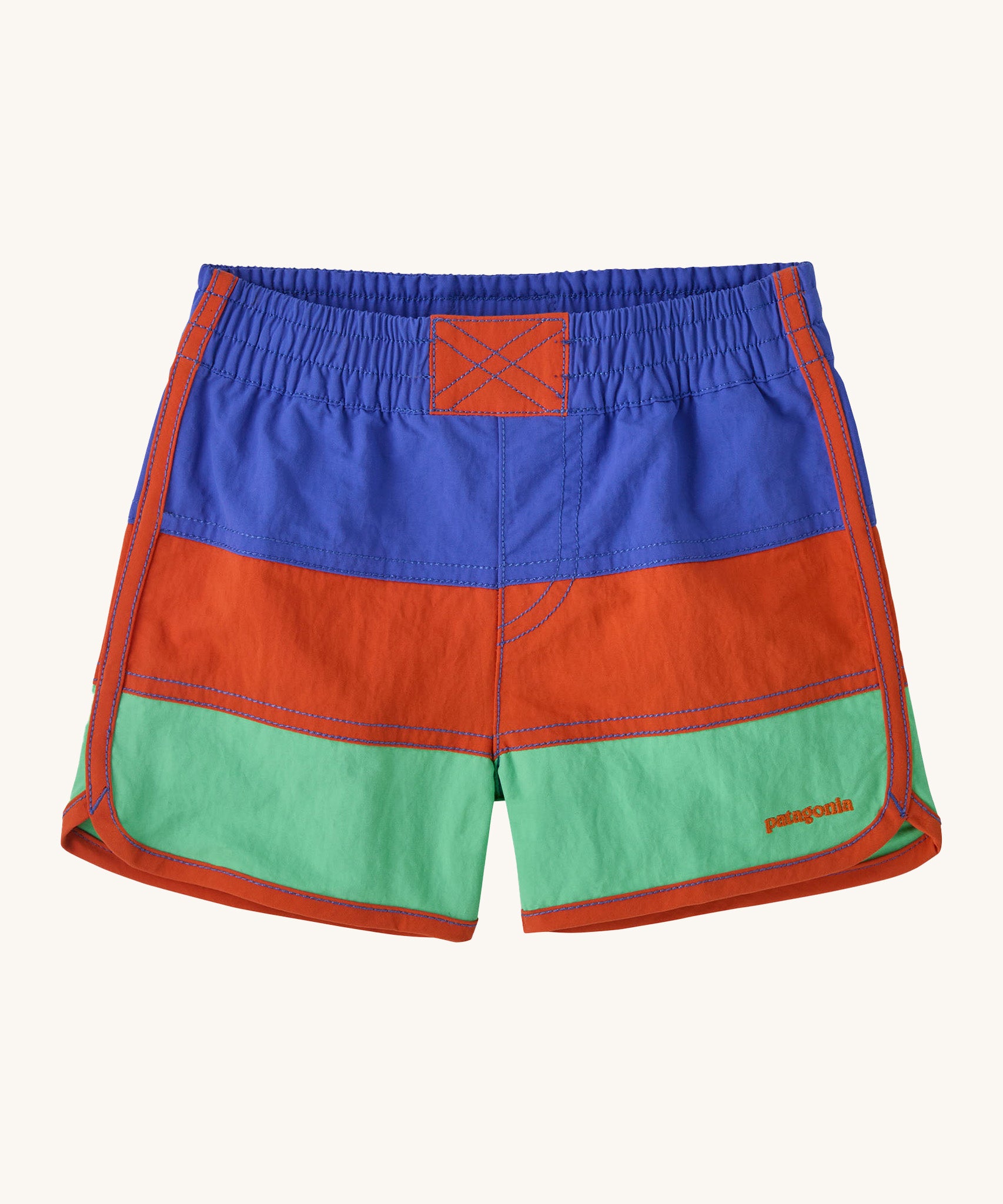 Patagonia kids swim shorts in 3 colour-block panel stripes - blue, red and light green - with binding down the seams and leg openings in red and scalloped detail at the side. Made with quick-drying NetPlus® 100% post-consumer recycled nylon.