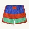 Patagonia kids swim shorts in 3 colour-block panel stripes - blue, red and light green - with binding down the seams and leg openings in red and scalloped detail at the side. Made with quick-drying NetPlus® 100% post-consumer recycled nylon.