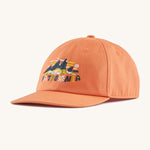 The Patagonia Kids Funhoggers Cap with a Fitz Roy Superbloom design on a Rock Melon colour.