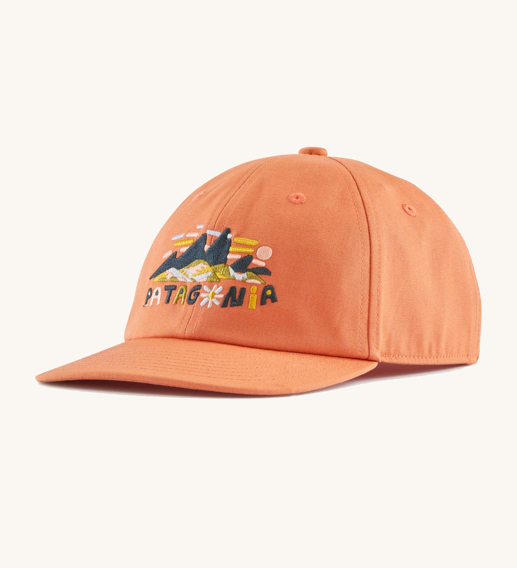 The Patagonia Kids Funhoggers Cap with a Fitz Roy Superbloom design on a Rock Melon colour.