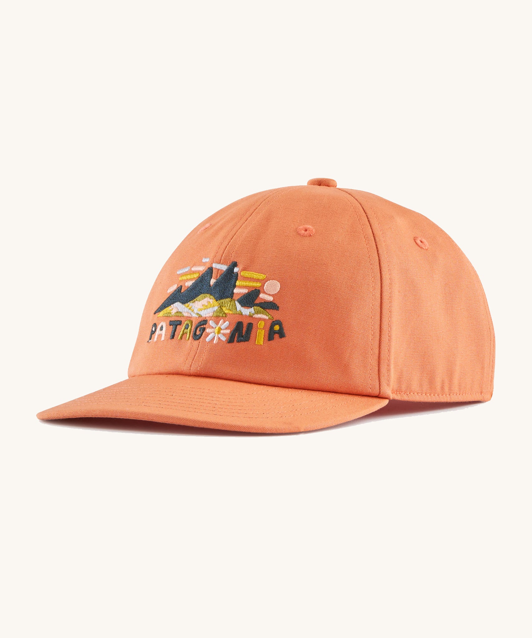 The Patagonia Kids Funhoggers Cap with a Fitz Roy Superbloom design on a Rock Melon colour.