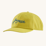 The Patagonia Kids Funhoggers Cap with a Wiggle Fitz design on a Bundle Green colour. 