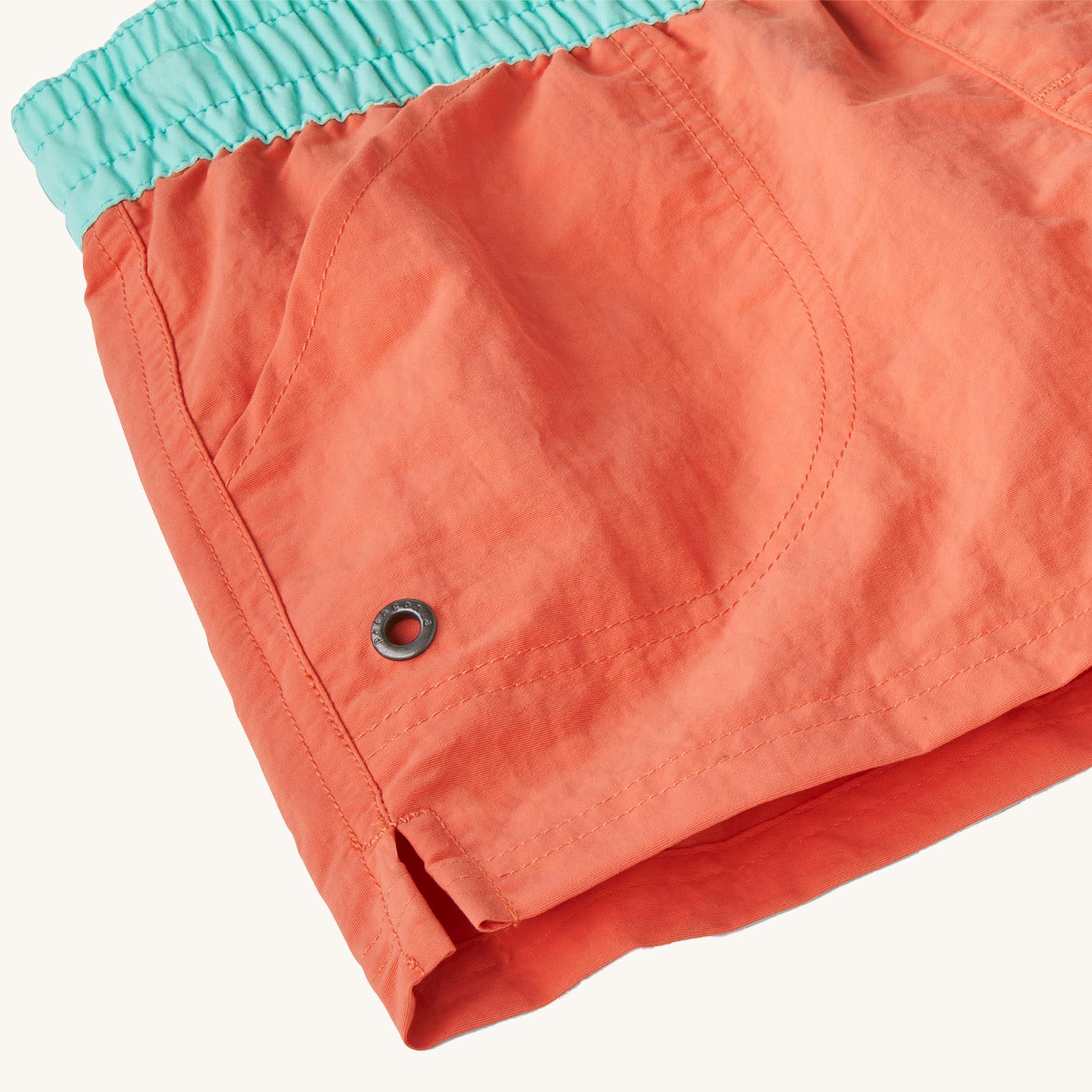 A close up of the sides on teh Patagonia Kids Costa Rica Unlined Baggies Shorts.