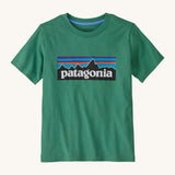 Patagonia kids short sleeve t-shirt in a dark green colour on a cream background