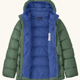 Patagonia kids hi-loft down sweater hoody windproof jacket in canopy green with a blue lining, zipped handwarmer pockets and small black logo on chest. Zip fully open showing the zipped pocket on the inside chest 