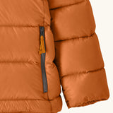 Close up of zipped handwarmer hand pockets on the Patagonia kids hi-loft down sweater hoody windproof jacket in marigold orange.