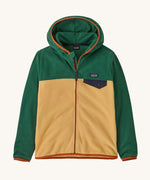 Patagonia Kids Micro D Snap-T jacket in a beeswax tan colour way on a plain background.