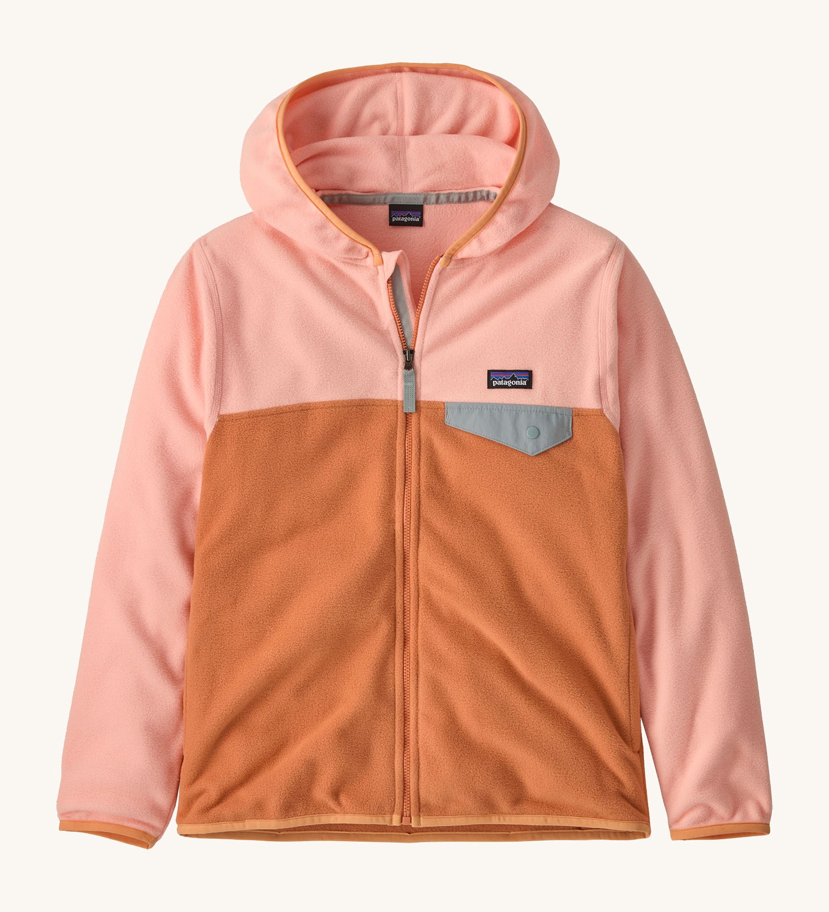 Patagonia kids hooded fleece in a light pink colour on a cream background.