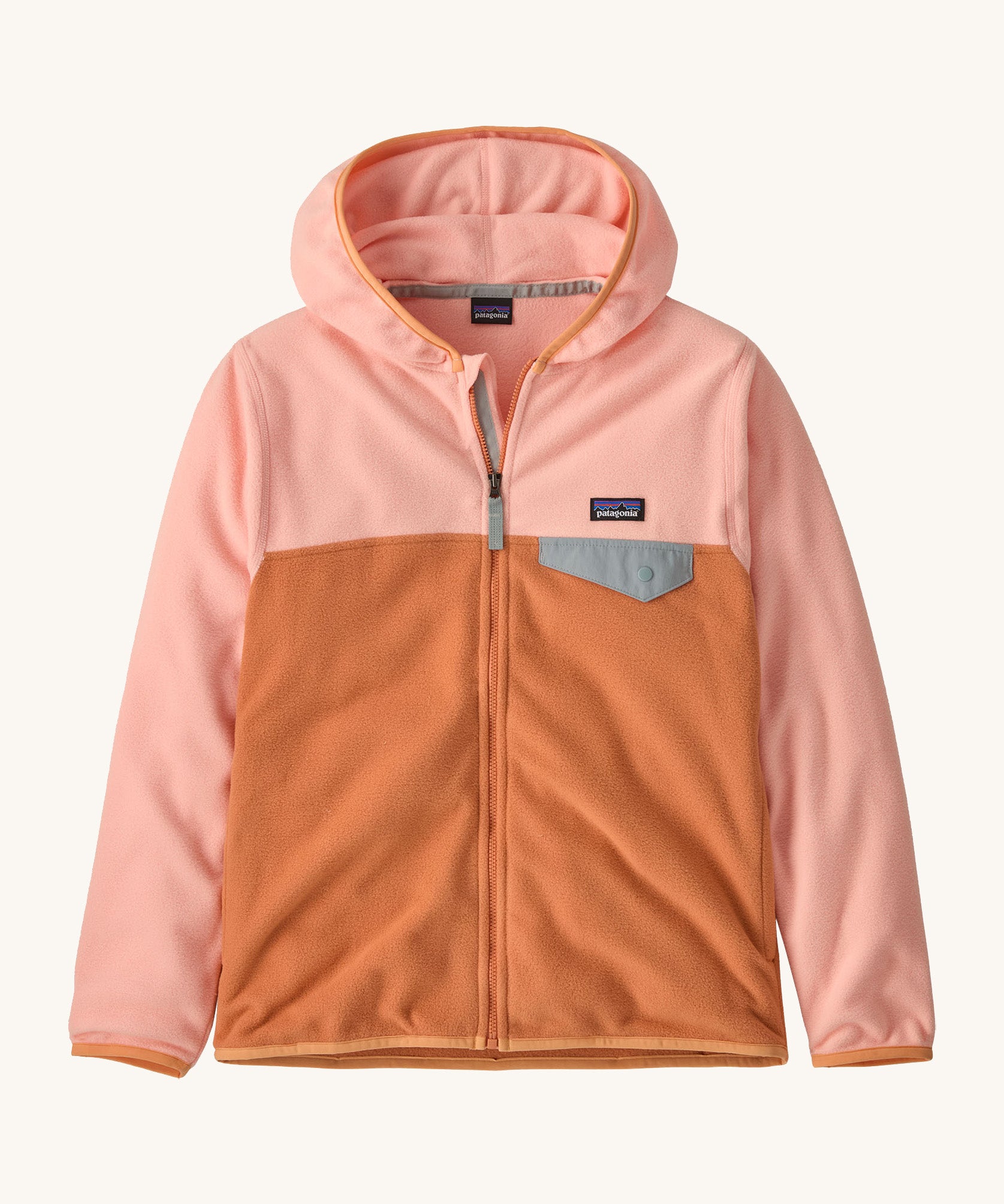 Patagonia kids hooded fleece in a light pink colour on a cream background.