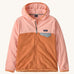 Patagonia kids hooded fleece in a light pink colour on a cream background.