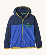 Patagonia kids hooded fleece in navy and blue on a cream background.