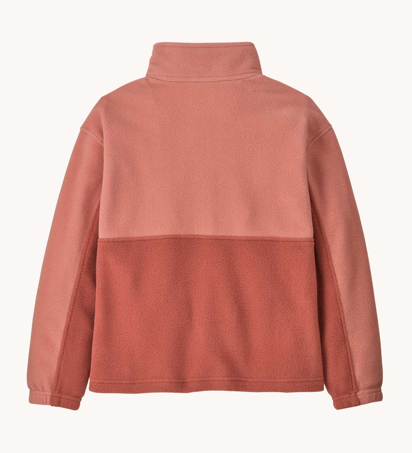 The back of the Patagonia kids microdini 1/2 zip pullover in potters red available at Babipur. A 100% recycled polyester soft fleece in pale red with navy trim. Features a turn up collar with a half length zip, elasticated cuffs and a chest pocket.