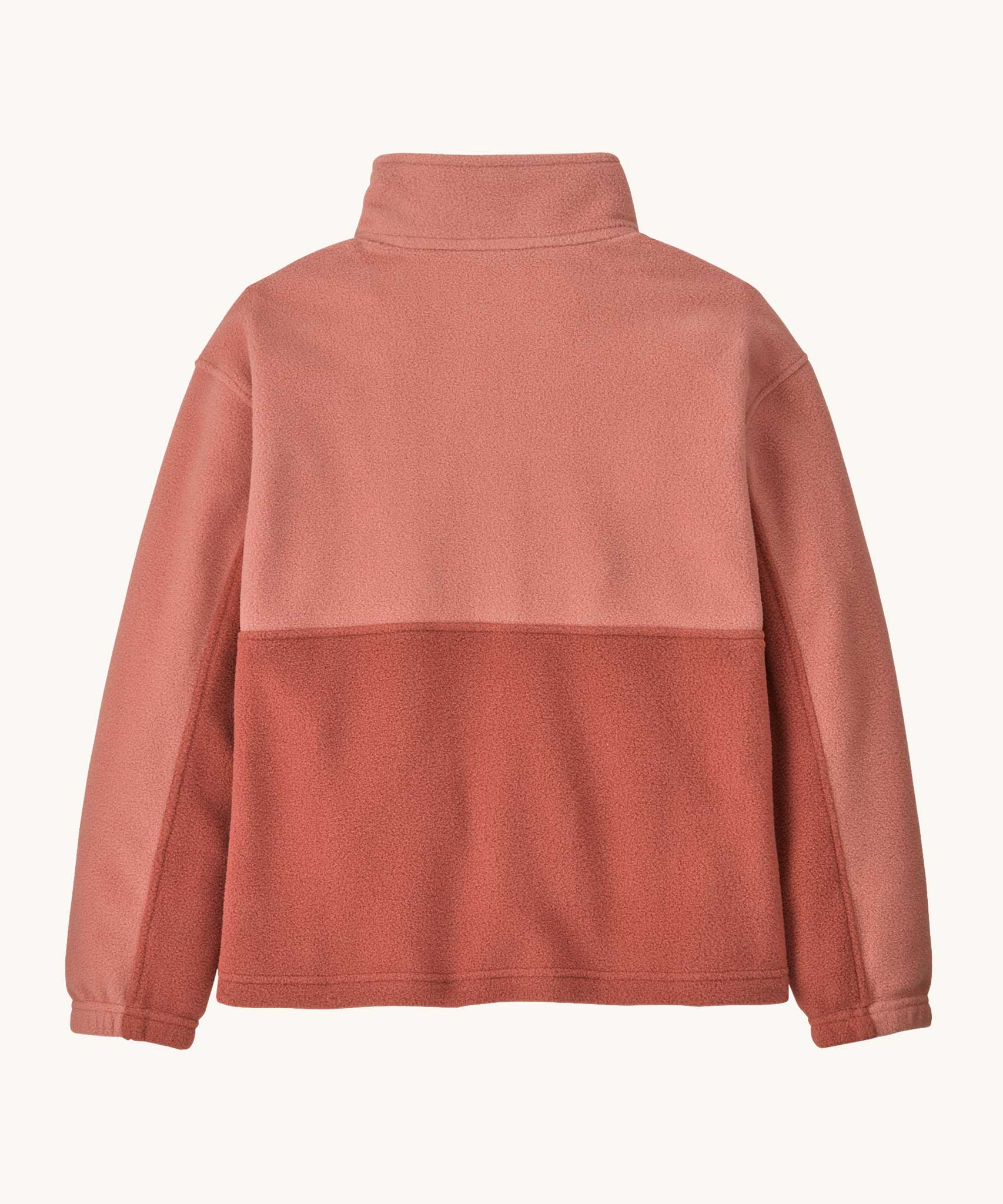 The back of the Patagonia kids microdini 1/2 zip pullover in potters red available at Babipur. A 100% recycled polyester soft fleece in pale red with navy trim. Features a turn up collar with a half length zip, elasticated cuffs and a chest pocket.