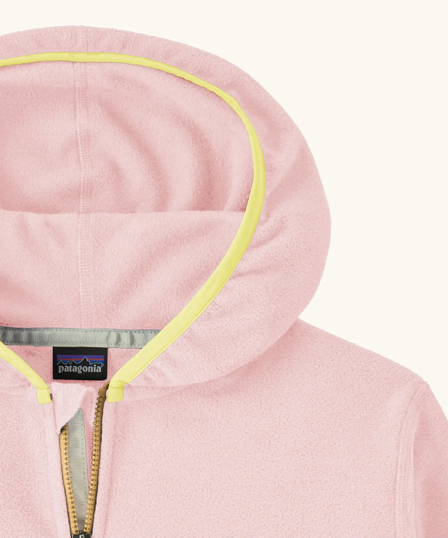 Close up of Patagonia kid's micro-d snap-t hooded jacket in purple and pink showing yellow trim around the hood