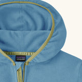 Close up of Patagonia kid's micro-d snap-t hooded jacket in blue showing dark yellow trim around the hood