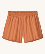 The Patagonia Kids Multi Trails Shorts 4 Inch in Rock Melon, technical sports shorts in peach pink with side seam pockets and a minimal elasticated waistband. Made from 90% OceanCycle recycled polyester.