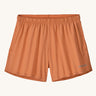 The Patagonia Kids Multi Trails Shorts 4 Inch in Rock Melon, technical sports shorts in peach pink with side seam pockets and a minimal elasticated waistband. Made from 90% OceanCycle recycled polyester.