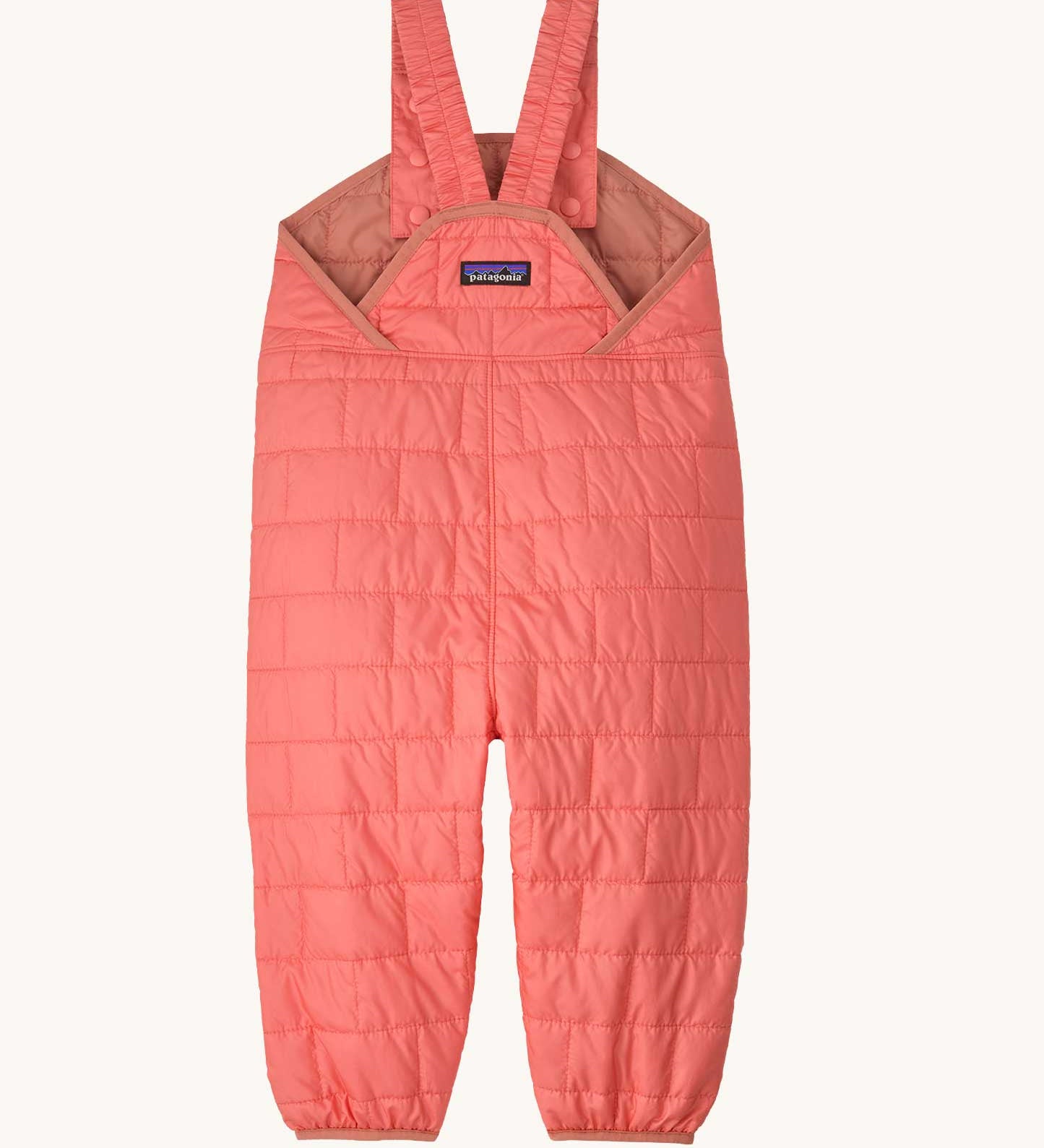 The back of the Patagonia kids nano puffer winter overalls in pink. Features popper fasteners on each shoulder strap for size adjustment. 