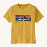 Patagonia kids short sleeve t-shirt in a dark yellow colour on a cream background