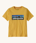Patagonia kids short sleeve t-shirt in a dark yellow colour on a cream background