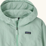 Hood of Patagonia kid's outdoor everyday hooded jacket in light green also showing front zip and small brand chest patch
