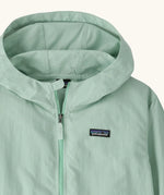 Hood of Patagonia kid's outdoor everyday hooded jacket in light green also showing front zip and small brand chest patch